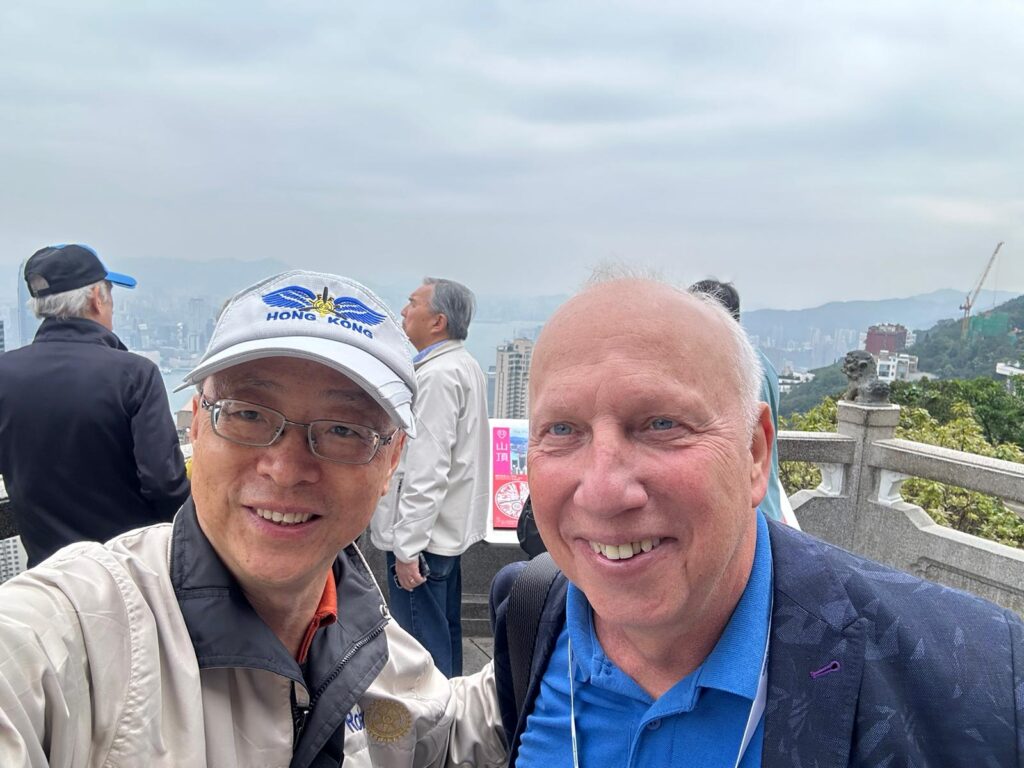 May be an image of 4 people, Victoria Peak and text