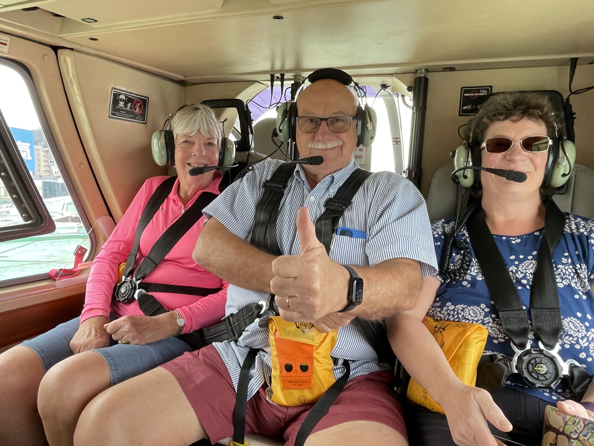 May be an image of 3 people and helicopter