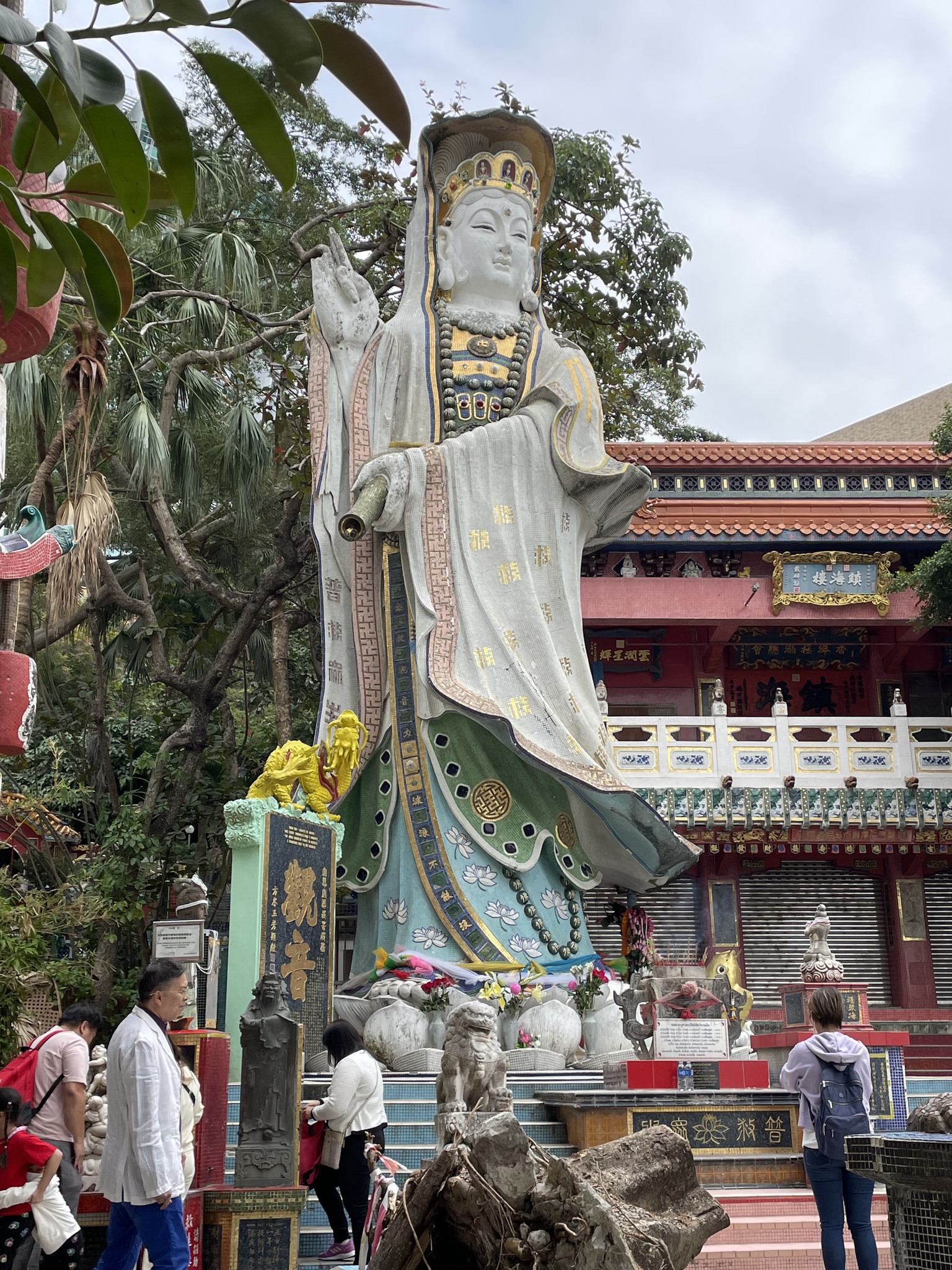 May be an image of 4 people, temple, Batu Caves and text
