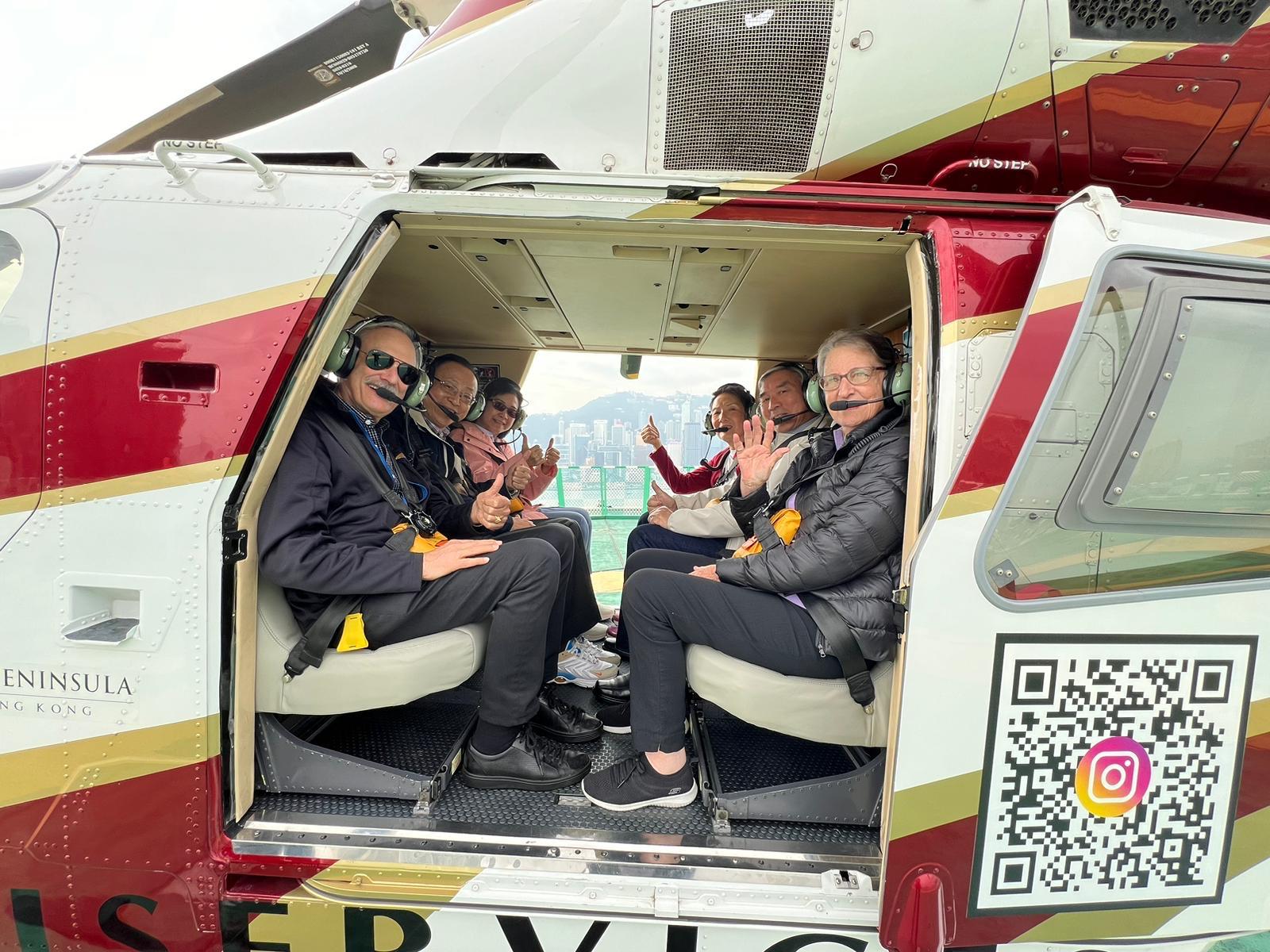 May be an image of 2 people, seaplane, helicopter and text