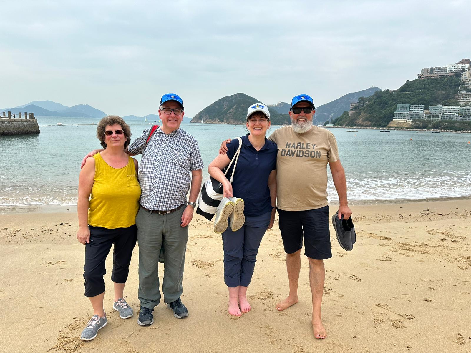 May be an image of 4 people, ocean and beach