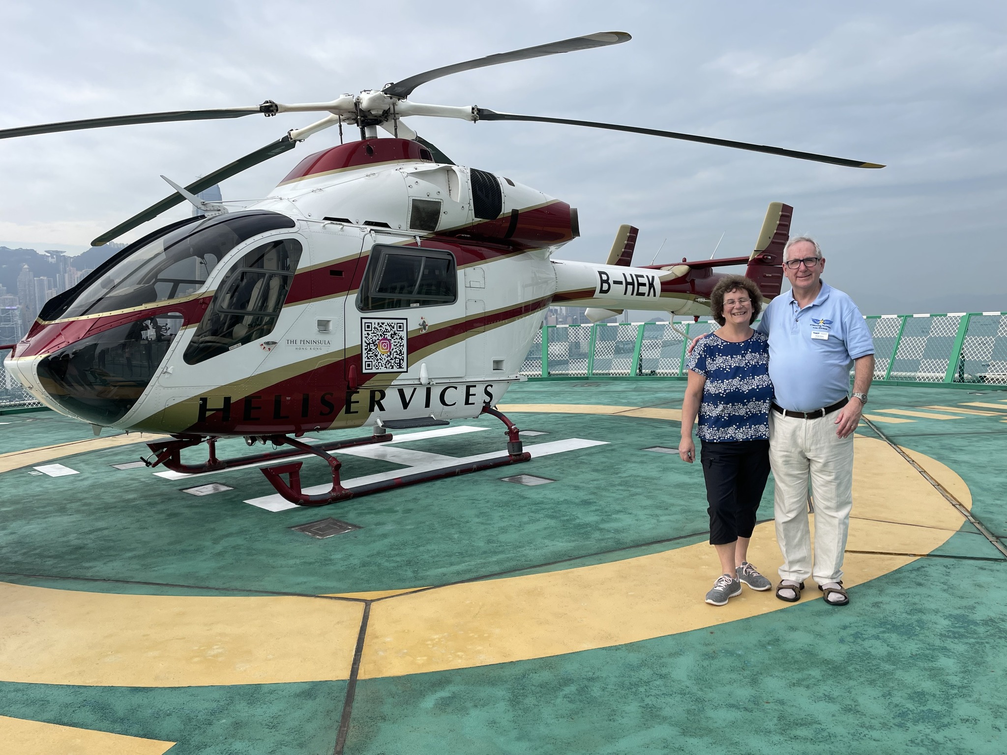 May be an image of 2 people, helicopter and text