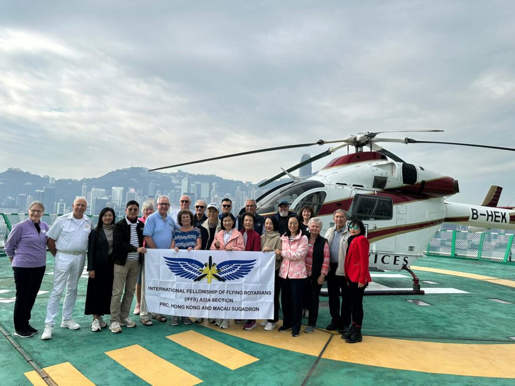 May be an image of 11 people, helicopter, hospital and text that says "B-HEx INTERNA INTERNATIONAL FELLOWSHIP INTERNATOLEN FLYING ROTARIANS PRC, HONG KONG AND MACAU SUQADRON (IFFR) ASIA SECTION ICES"