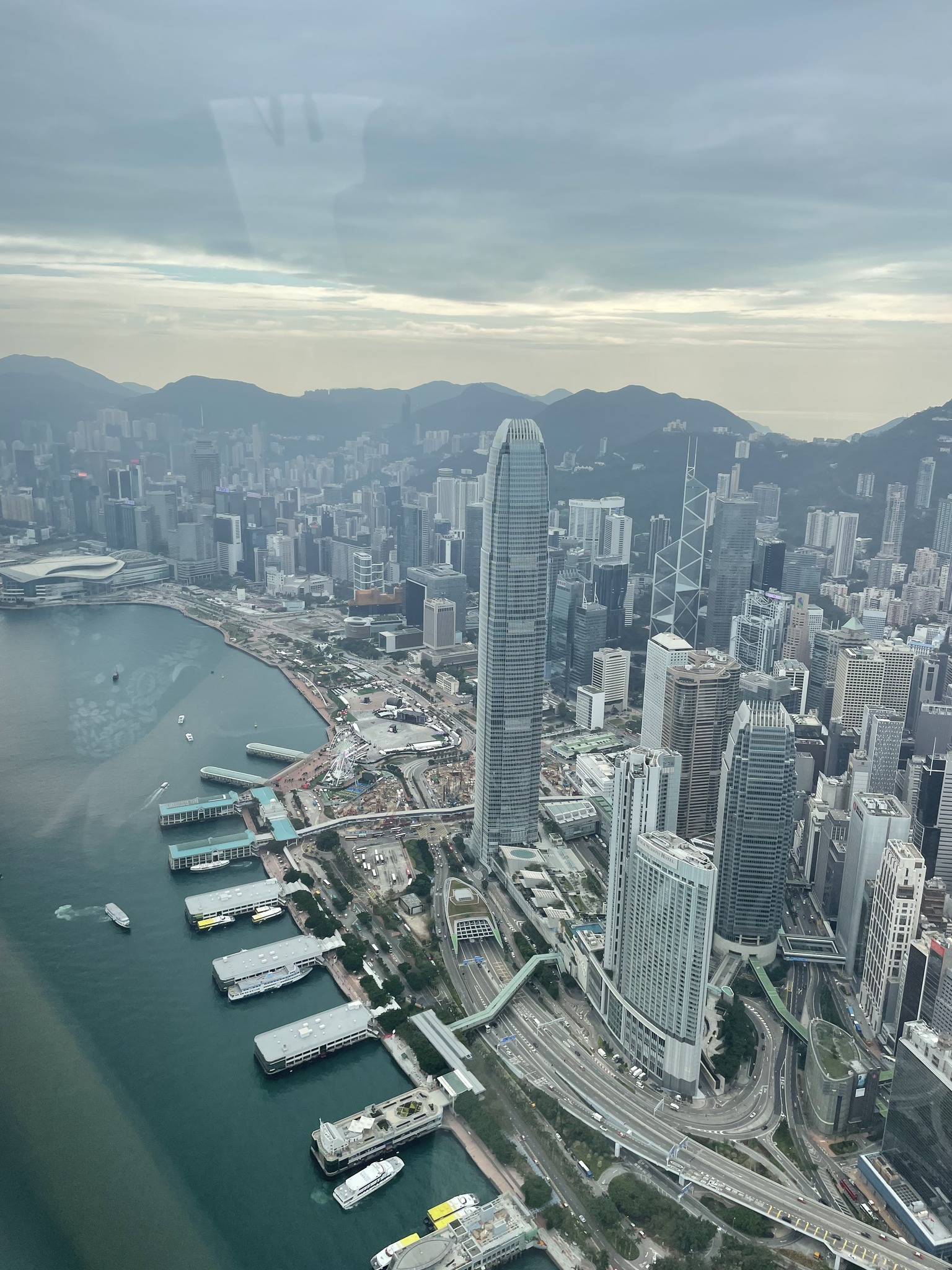 May be an image of cable car, helicopter, skyscraper and Victoria Peak